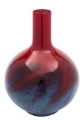 A Royal Doulton 'Flambé Veined' bottle vase: with globular body and slender neck,