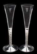 A group of four English wine glasses: comprising a pair with bell-shaped bowls with basal tiers