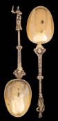 A pair of Continental silver-gilt serving spoons: with pear-shaped bowls,