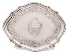 A George III silver teapot stand, maker Henry Chawner, London, 1794: of cartouche-shaped outline,