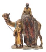 After Franz Bergman a twentieth century cold painted spelter table lighter: of a camel and carpet