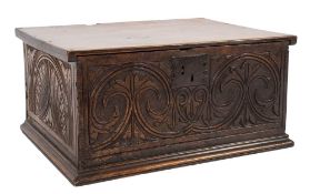 A 17th Century carved oak and fruitwood bible box:, with a plain hinged top,