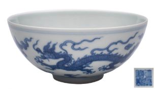 A Chinese blue and white dragon bowl: with rounded sides,
