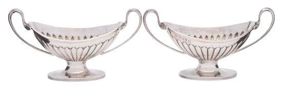 A pair of Victorian silver pedestal salts, maker Edward Hutton, London,