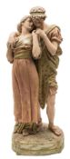 A large Royal Dux group of lovers: the youth and his companion wearing classical dress and in an