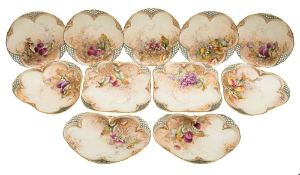 A Royal Worcester fruit painted porcelain dessert service: each piece of shaped and reticulated
