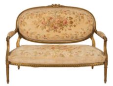 A carved giltwood canape in the Louis XVI transitional taste:, with rosebud,