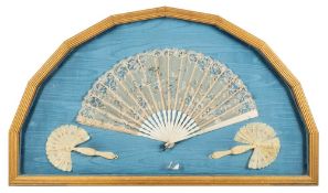 A 19th century English ivory fan: with painted silk and applied lace leaf decorated with a painted