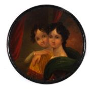 A 19th century papier mache snuff box: the circular lid decorated with a portrait of two young
