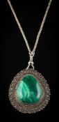 A pear-shaped malachite panel pendant/ brooch: stamped 'Silver' with mesh-link chain attached.