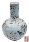 A Chinese pale turquoise-ground bottle vase: painted en-grisaille with a magpie amongst wisteria