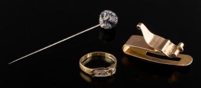A 9ct gold 'buckle' ring, a yellow metal clip and a stick pin.