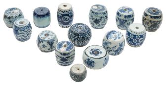 A collection of fourteen Chinese blue and white porcelain scroll weights: of barrel form,