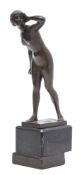 After Meisel A bronze study of a naked female: with left hand raised to her hair,