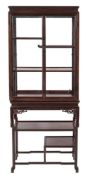 A Chinese wood display cabinet on a stand:, the upper part with a moulded frieze,