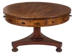 A William IV mahogany circular drum top library table:, fitted with four frieze,
