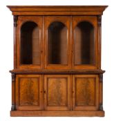 A Victorian mahogany library bookcase:, the upper part with a moulded cornice,