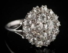 A diamond circular cluster ring: with graduated round,