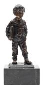 A bronze figure of a Dutch boy with satchel: indistinctly signed O.