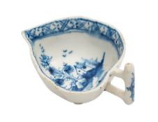A Lowestoft blue and white butterboat: of leaf shape with stalk handle,
