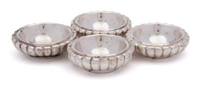 A set of four Continental silver salts: of circular reeded outline, 7cm. diameter, 231gms, 7.43ozs.