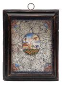 An 18th century Continental cut paper picture: with central painted oval with The Sacred Heart