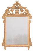 A carved giltwood mirror:, with pierced and shaped flowerhead, foliate scroll,