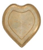 A large brass tray: of heart-shaped outline, with embossed grape and vine leaf decoration, 116cm.