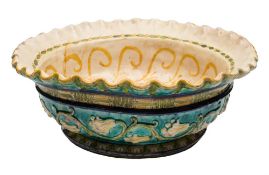 A large Della Robbia Pottery bowl by Lizzie Wilkins: with flared wavy rim,