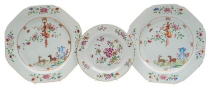 A pair of Chinese famille rose plates and one other: the pair painted with a stag and doe,