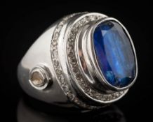 A kyanite and diamond dress ring: with central oval, blue kyanite approximately 16.