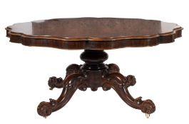 A Victorian rosewood circular scallop edge dining table:,