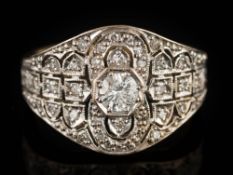 An 20th century 18ct gold and diamond Art Deco-style cluster ring: mille-grain-set with round,