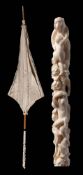 A late 19th/ early 20th century Japanese parasol: with foliate embroidered silk canopy,