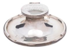 A George V silver capstan inkwell, maker Elkington & Co, Birmingham, 1910: inscribed,