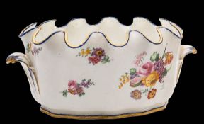 A pair of Sèvres porcelain verrières: each of lobed oval form with crenellated rim and scroll