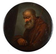 A 19th century papier mache snuff box: the circular lid decorated with a portrait of a monk with