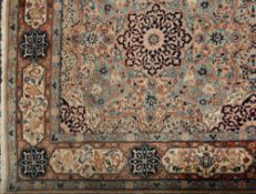 A Meshed carpet:, of large size, the beige,