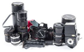 A Minolta xm 35mm camera: with lens and case and a Hanimex wide angle lens,