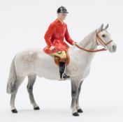 A Beswick Huntsman on grey horse:, No 1501, 21cm high.