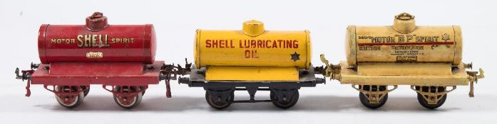 Hornby O gauge, a group of six petrol tank wagons:, ' Motor BP Spirit', 'Pratts', 'Redline',
