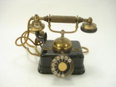 An early 20th century Danish brass and lacquer telephone by K Jobenhavns:,