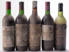 A bottle of Chateau La Grave 1986, a bottle of Chateau Maison Neuve 1985,