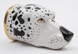 A Continental porcelain stirrup cup in the form of the head of a Dalmatian: modelled after a Derby