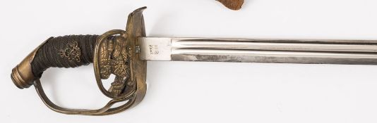 A Prussian M1889 pattern sword by W K & C:, the straight single edge blade with double fuller,