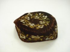 A late Victorian brown silk embroidered smoking hat:,with floral decoration.
