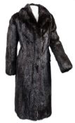 A lady's black fur three quarter length coat:, in a Calman Links bag.