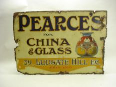 An early 20th century enamel advertising sign for 'Pearce's For China And Glass, 39 Ludgate Hill,