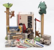 A collection of various toys:, including a Japanese clockwork drinking bear,