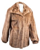 A mid 20th century fur jacket:, with brown silk lining.